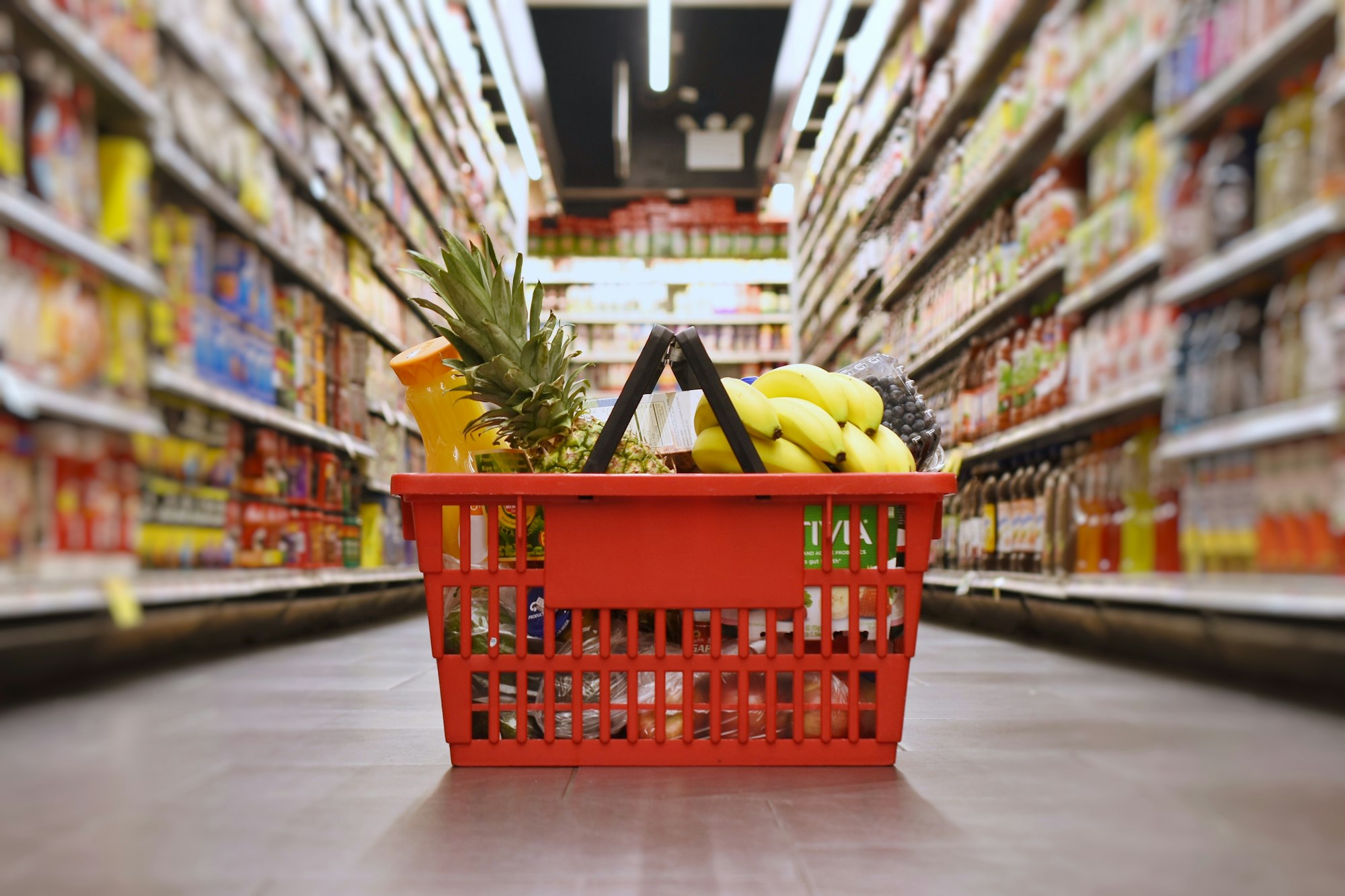 Basket with groceries in the supermarket